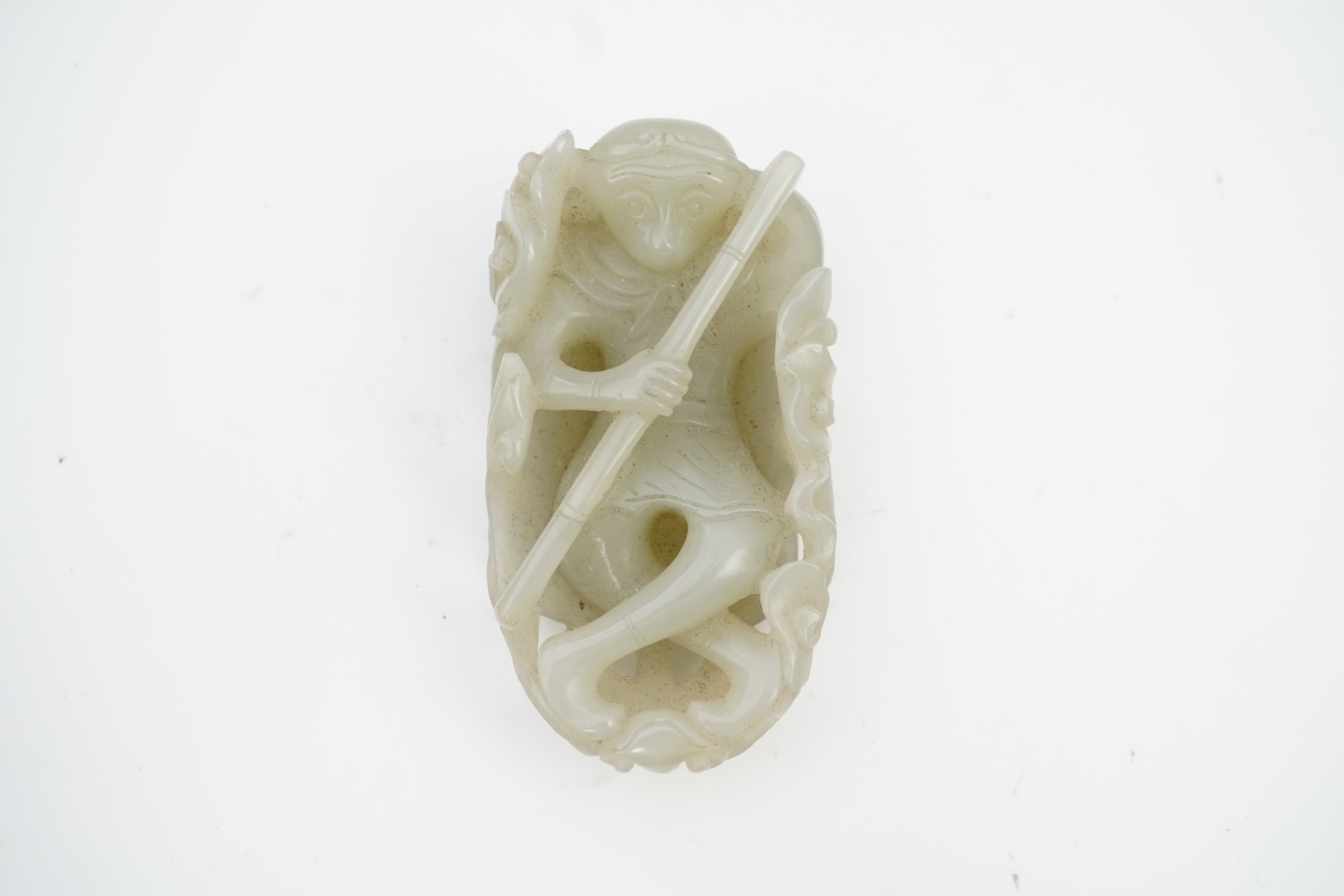 A Chinese pale celadon jade carving of Sun Wukong, the Monkey King, 18th/19th century